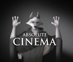 absolute_cinema absurd_res anthro canid canine canis cape chair cheek_tuft claws cloak clothing crossed_legs death_(puss_in_boots) dreamworks eyes_closed facial_markings facial_tuft front_view fur furniture fuzzy gradient_background grey_background greyscale hands_up head_markings hi_res male mammal markings mask_(marking) meme monochrome movie_theater poncho puss_in_boots_(dreamworks) raised_arm raised_arms simple_background sitting solo sunstripe tagme text tuft white_body white_fur wolf